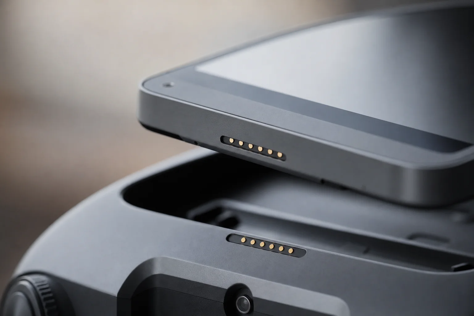 Close-up of detachable screen module with touchscreen and contact points