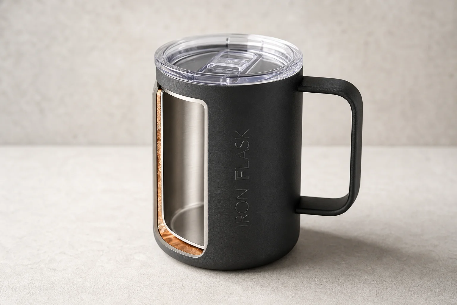 Collection of ten insulated bottles and travel mugs displayed on concrete surface