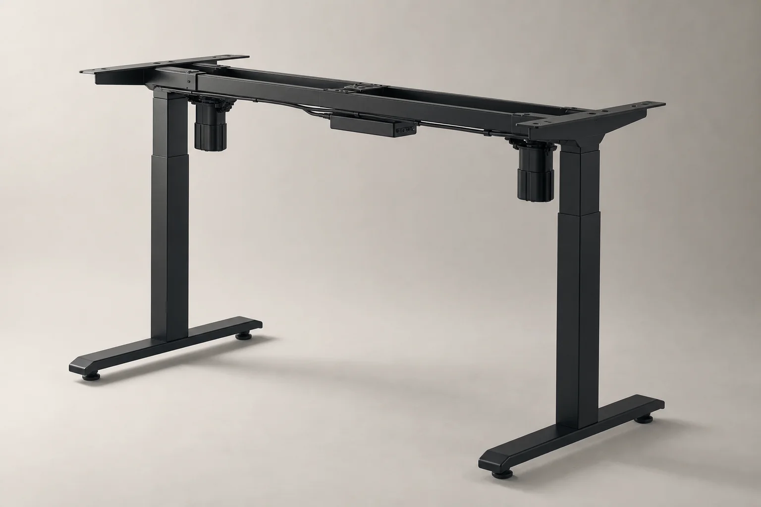 Modern standing desk in raised position with laptop and monitor in bright home office