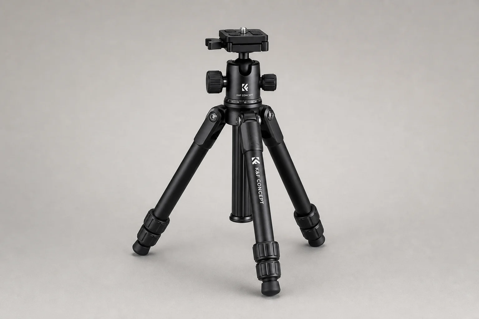 Sony A6400 mirrorless camera with attached zoom lens on brushed aluminium surface