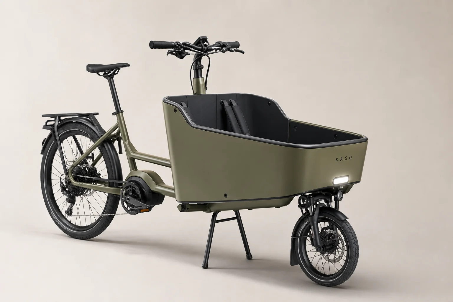 Kago cargo bike with front-mounted box and integrated safety features on neutral backdrop