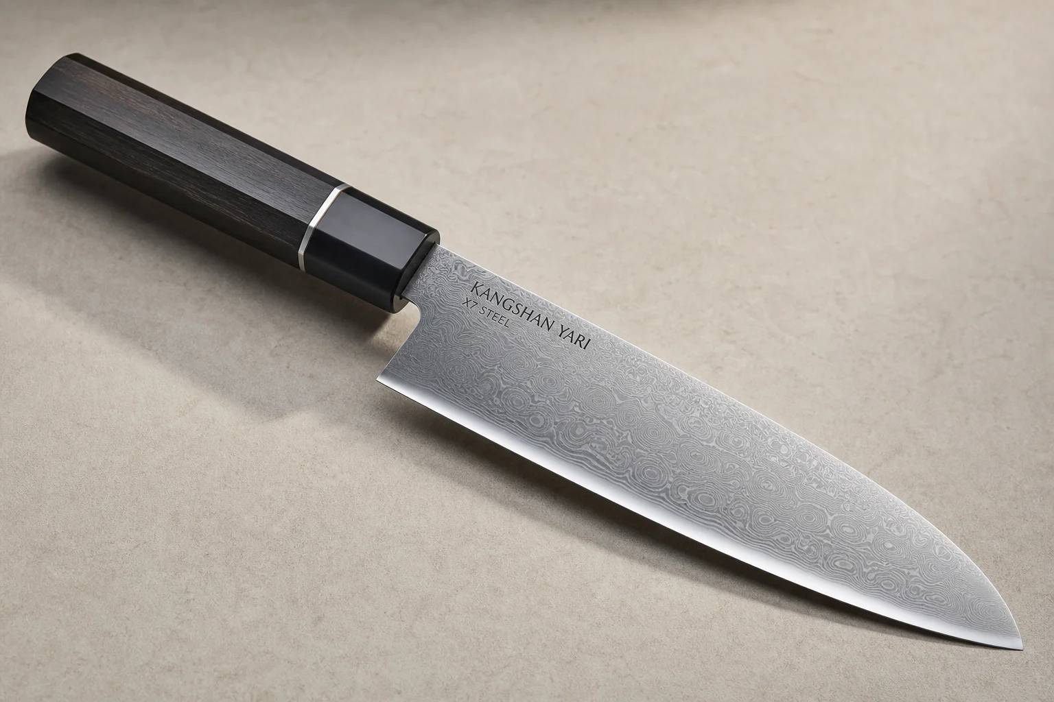 Collection of eight chef's knives arranged diagonally on concrete surface showing various styles and price points