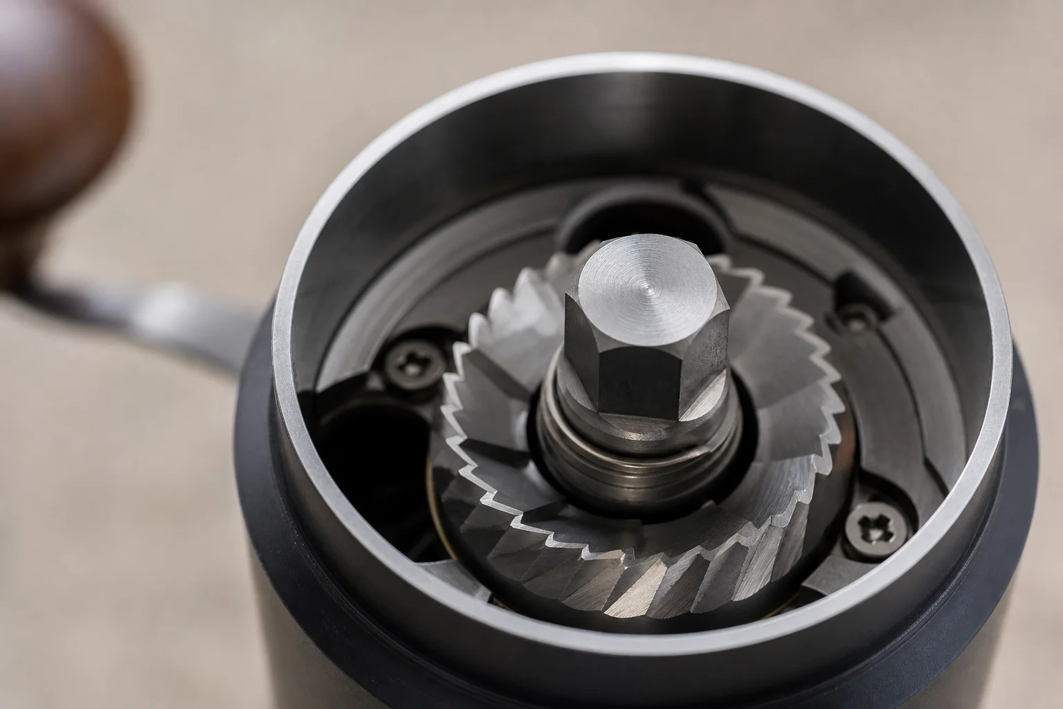 Close-up of metal burr mechanism inside a hand grinder