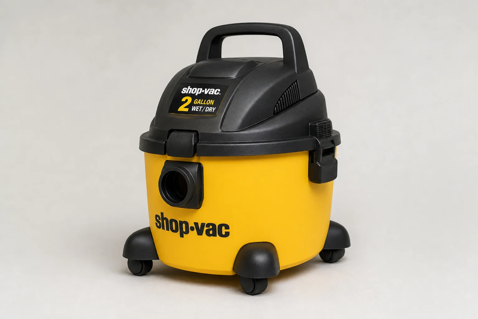 Eight wet/dry vacuums of varying sizes arranged on concrete surface
