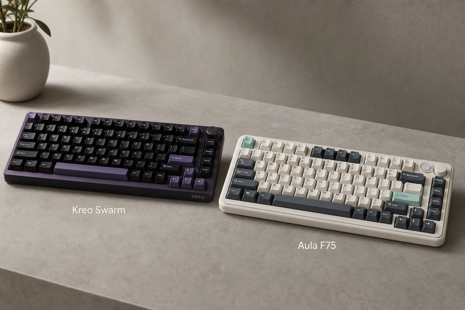 Kreo Swarm and Aula F75 mechanical keyboards side by side on concrete