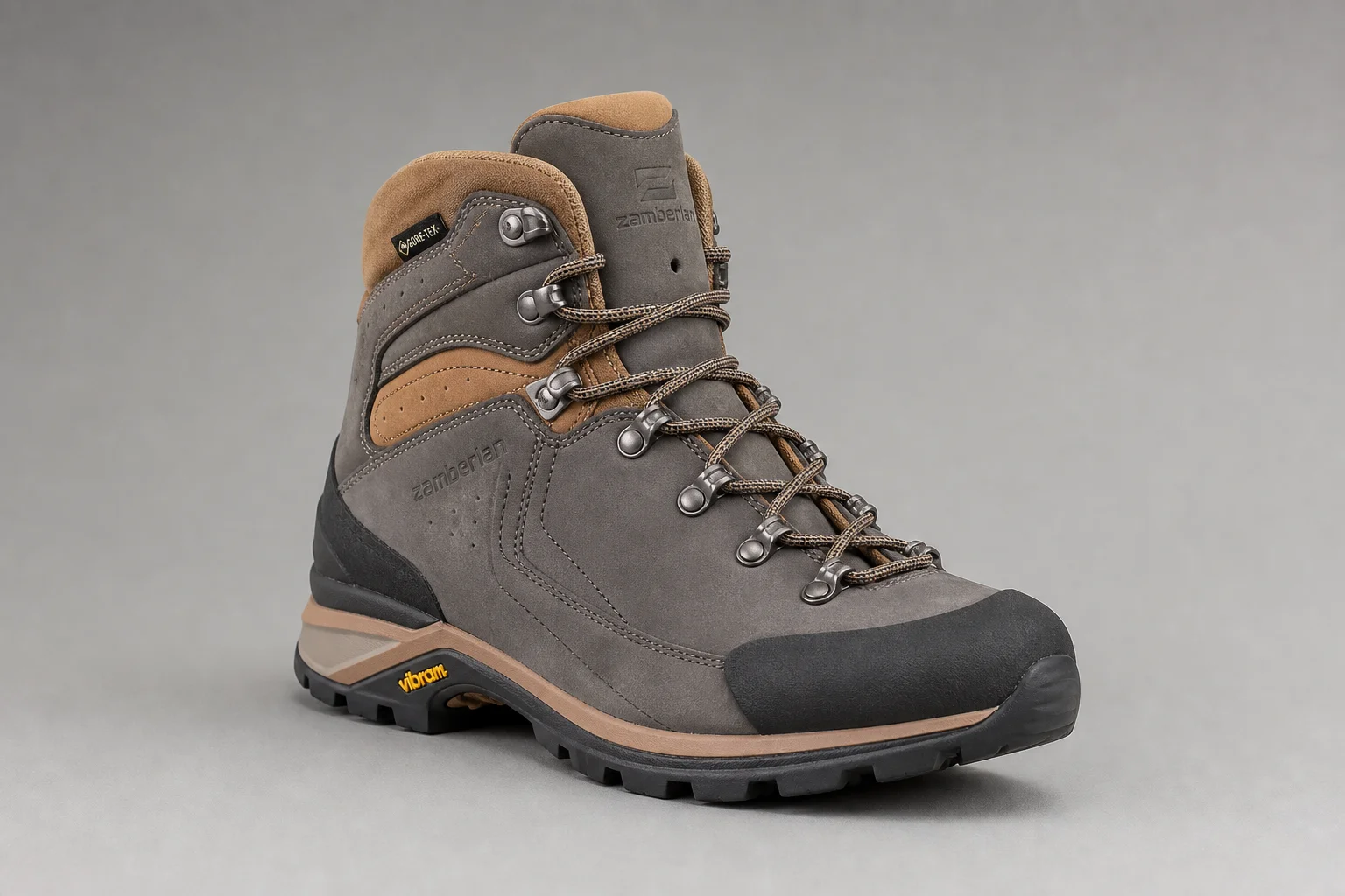 Five hiking boots arranged diagonally on concrete surface