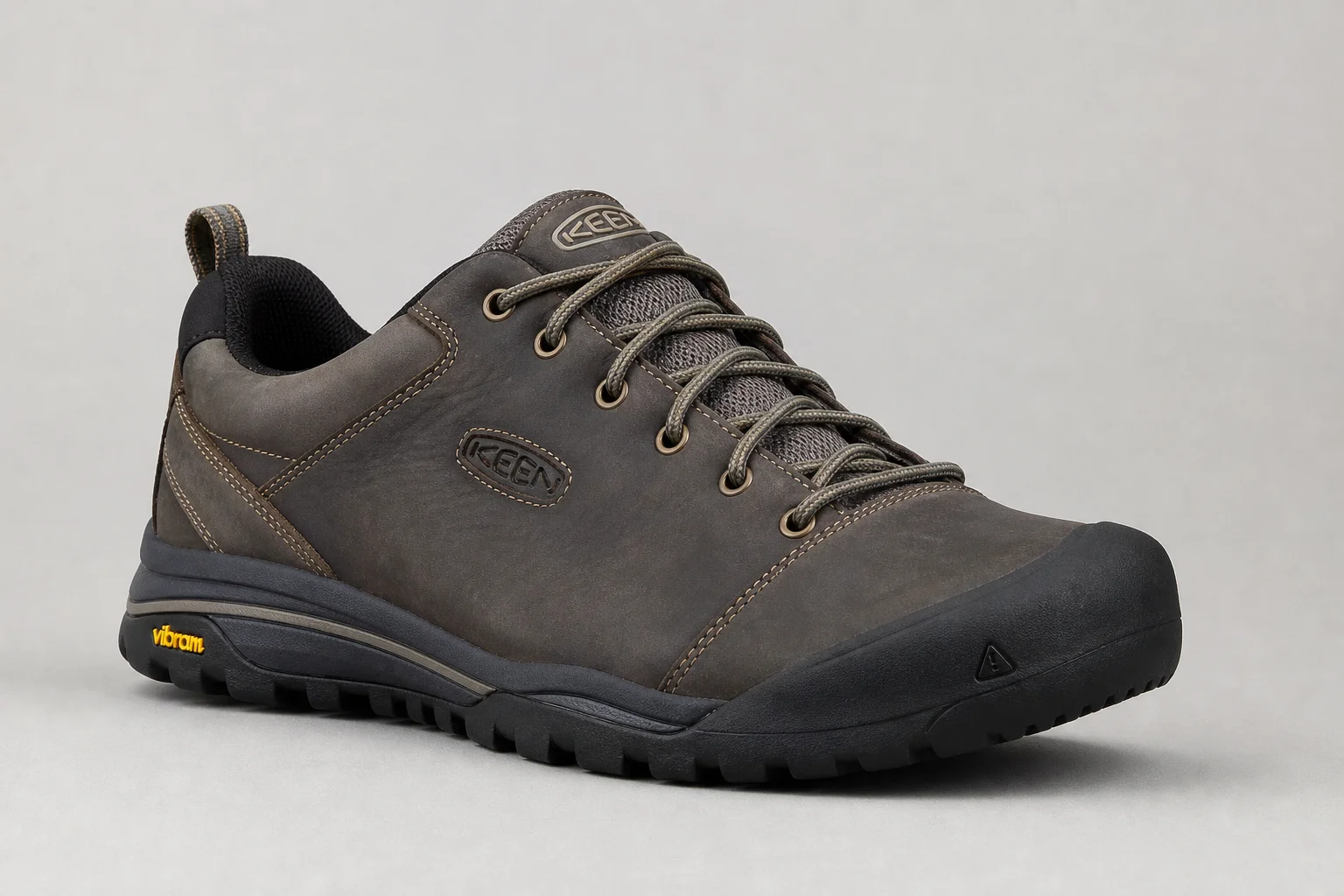 Five women's hiking shoes arranged on concrete surface in descending order