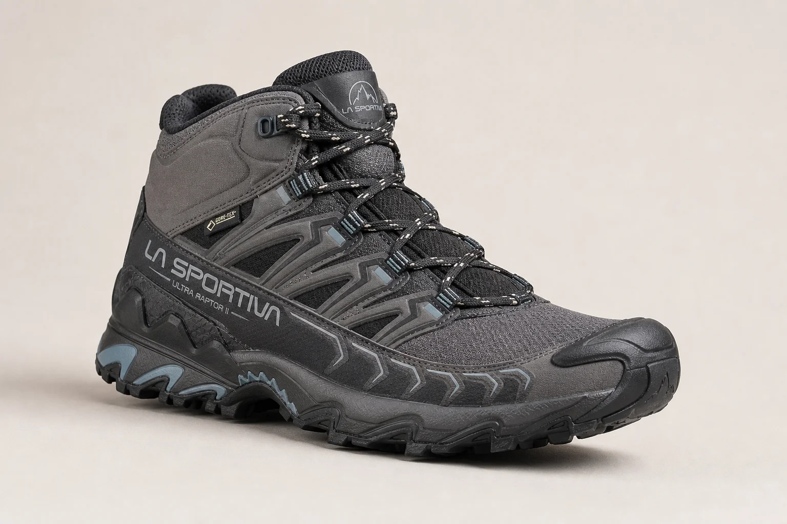 Seven hiking boots arranged on concrete surface representing different styles and purposes