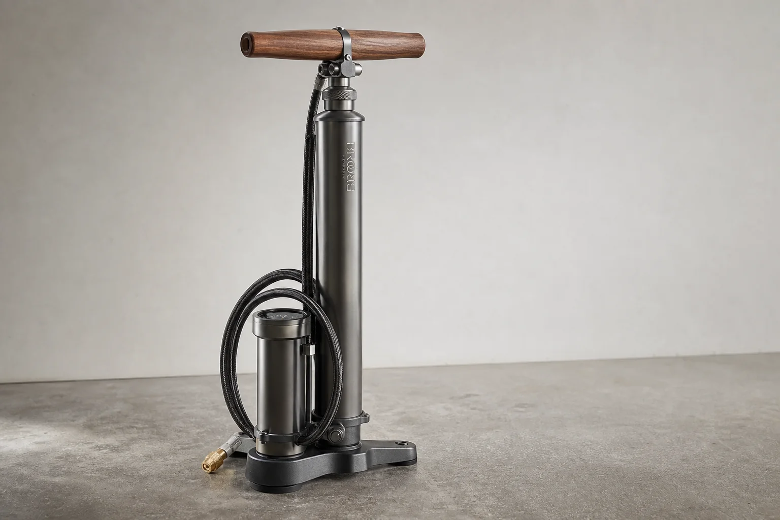 Five bike pumps displayed on concrete surface in staggered arrangement