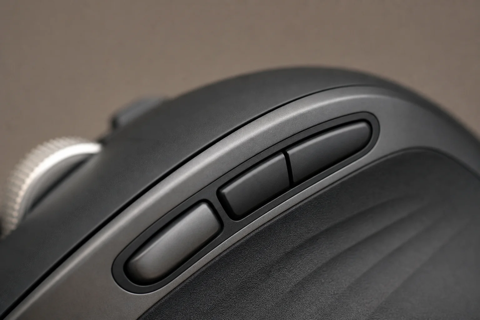 Close-up of mouse thumb button and customizable side buttons