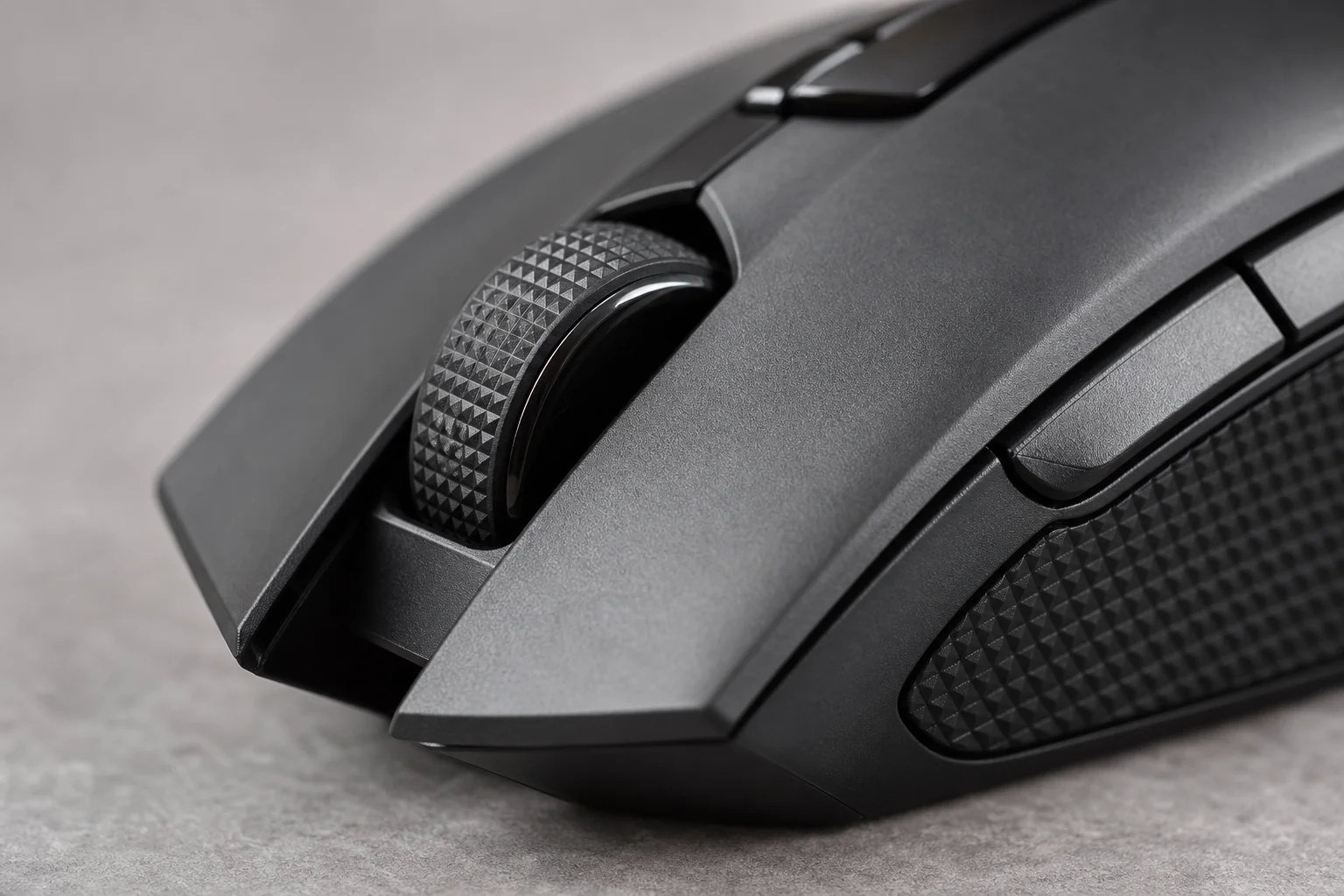 Close-up of gaming mouse scroll wheel and side buttons with tactile details