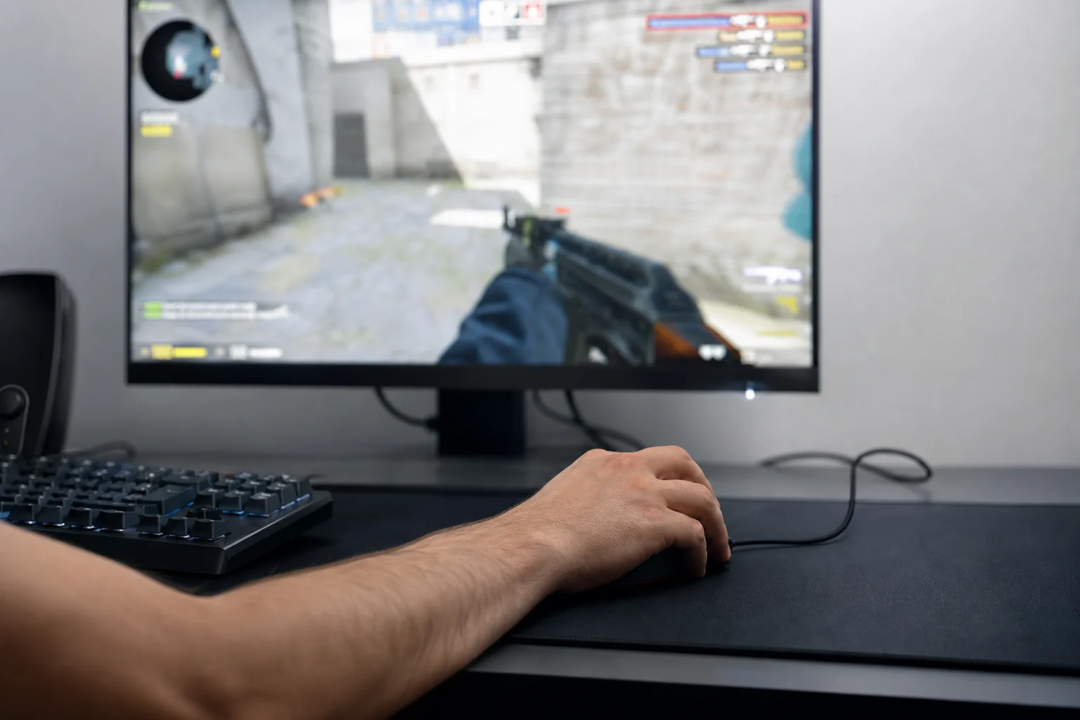 Gamer's hand executing precise mouse aim adjustment during competitive play