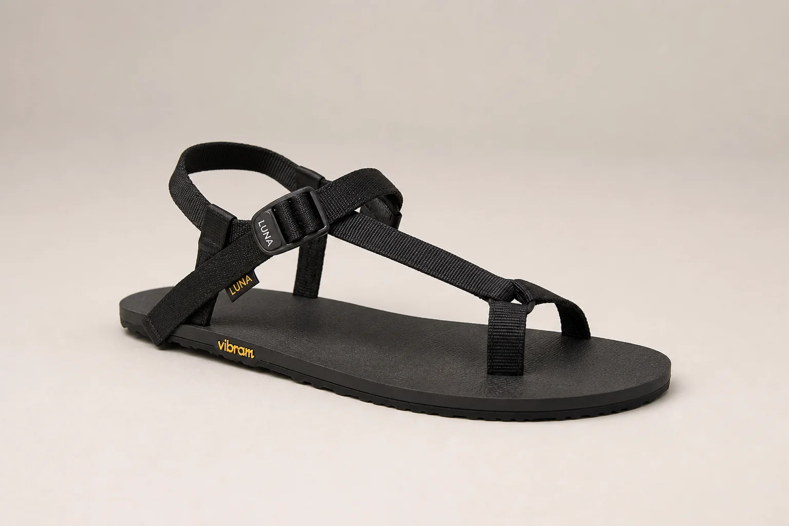Five hiking sandals arranged on concrete surface representing different styles and protection levels