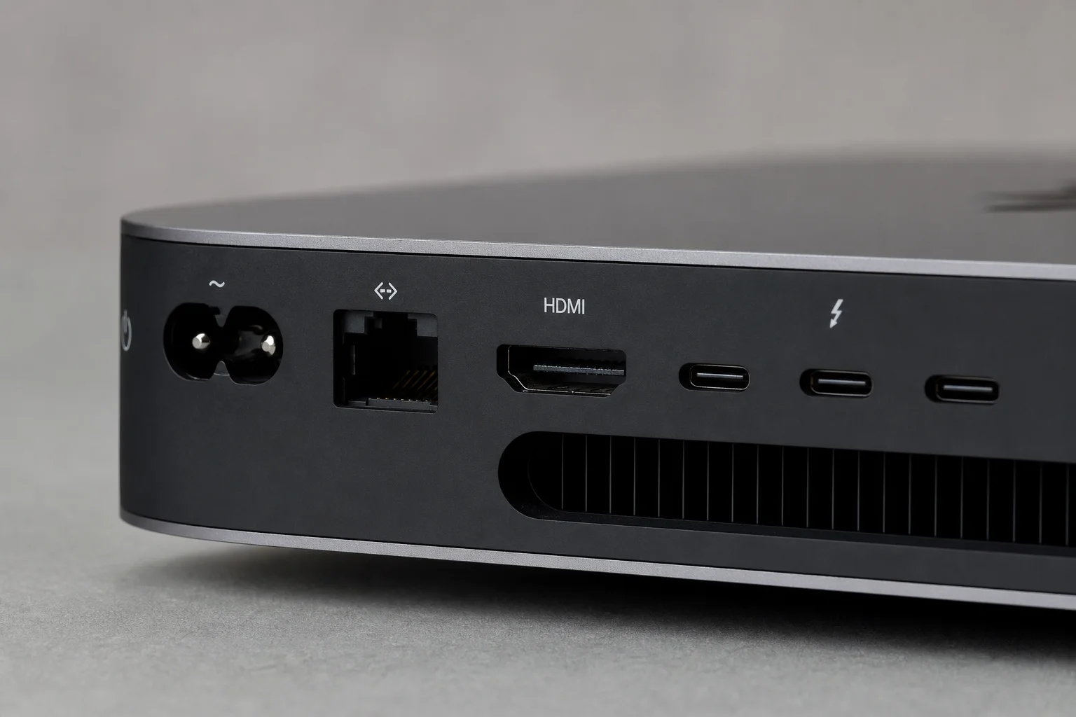 Close-up of Mac mini rear ports showing Ethernet, HDMI, and Thunderbolt connectivity
