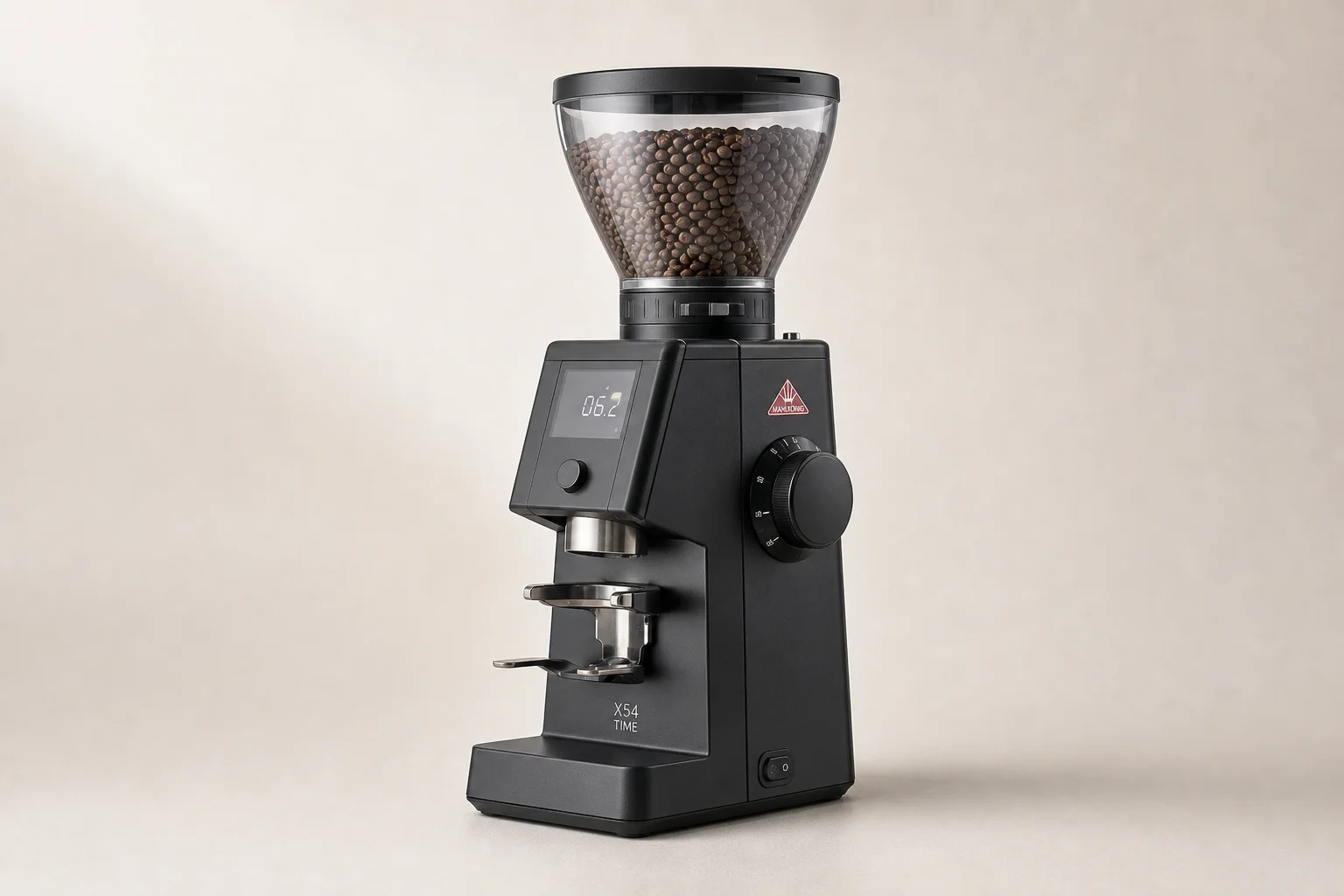 Seven espresso grinders of various sizes and styles arranged on concrete surface