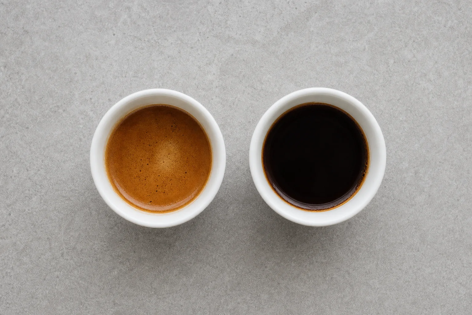 Two cups of brewed coffee side by side showing color and extraction differences