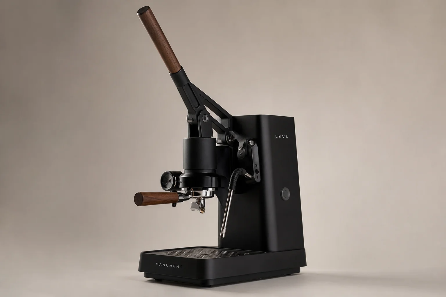 MANUMENT Leva espresso machine with black finish and wood lever accents on neutral background