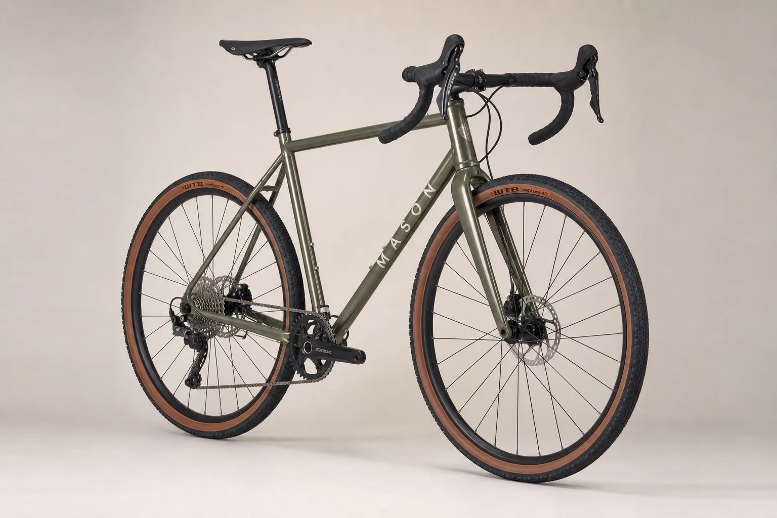 Multiple allroad bikes displayed on neutral backdrop showing different frame materials and designs
