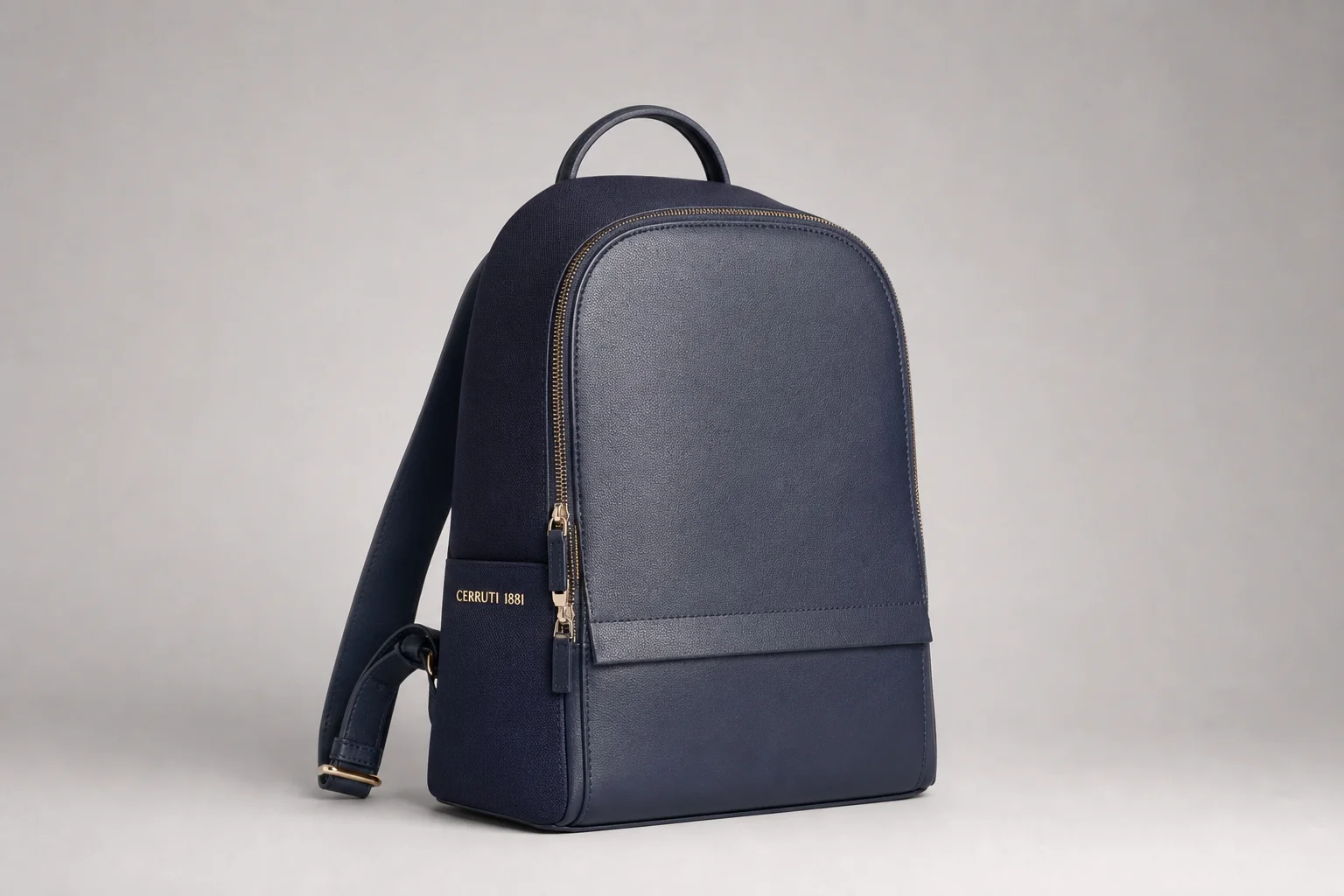 Five backpacks in different styles and colors arranged on concrete surface