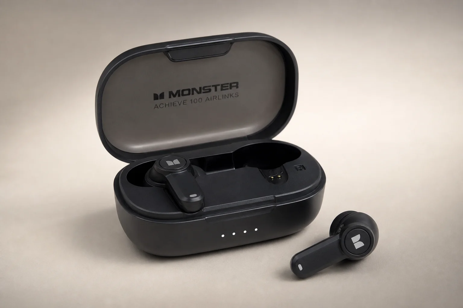 Five wireless earbuds arranged on concrete surface