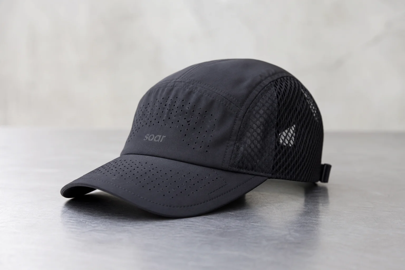 Nine running caps in various styles and colors arranged on neutral backdrop