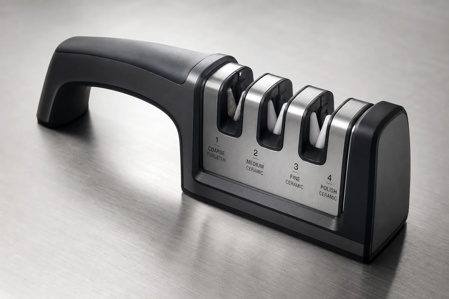 Five knife sharpeners arranged on concrete surface from manual to professional electric models