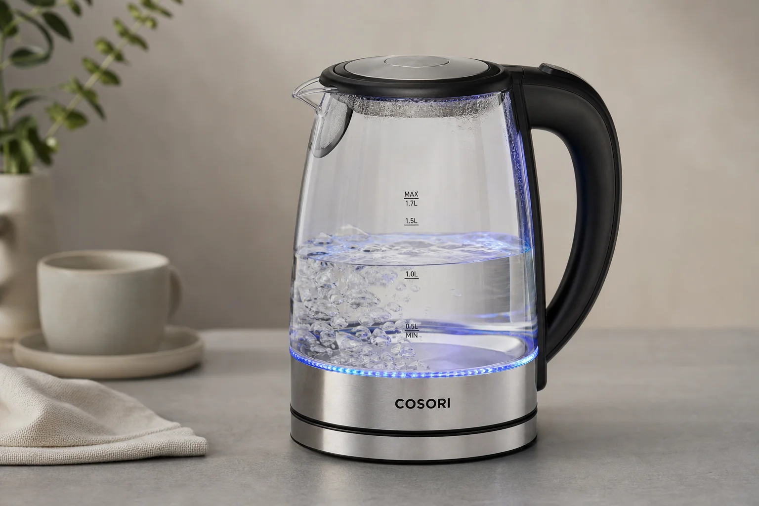 Five electric kettles in descending order of ranking on a concrete surface