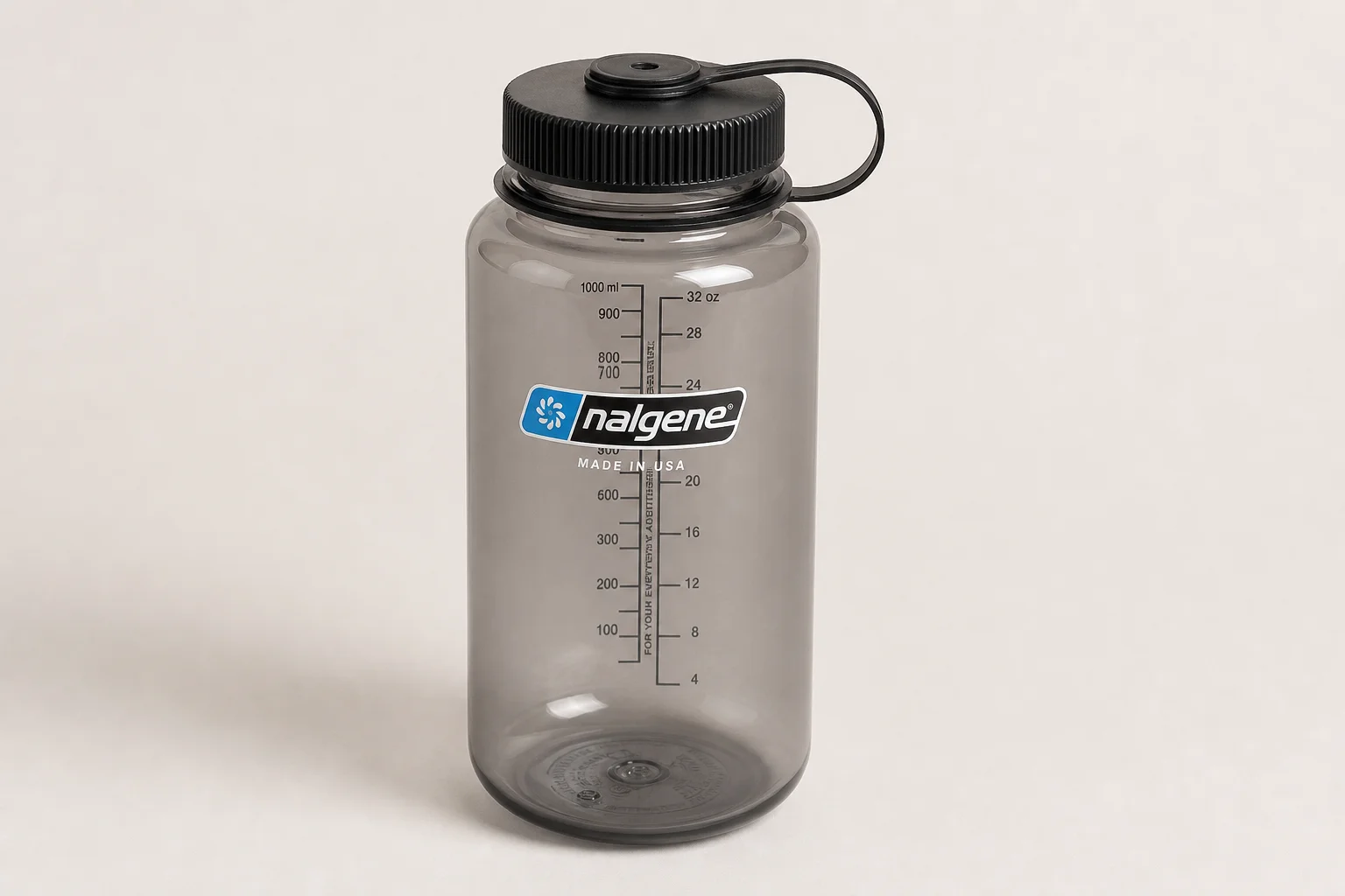 Hiking water bottles and filters arranged on neutral surface