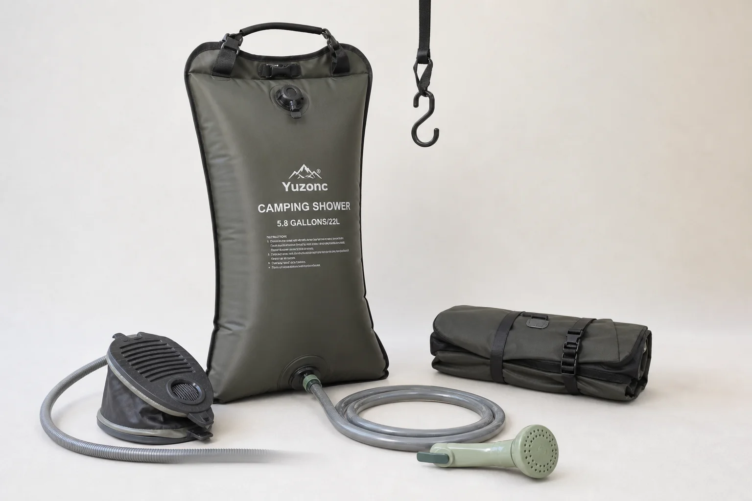 Five camping shower models arranged on concrete surface