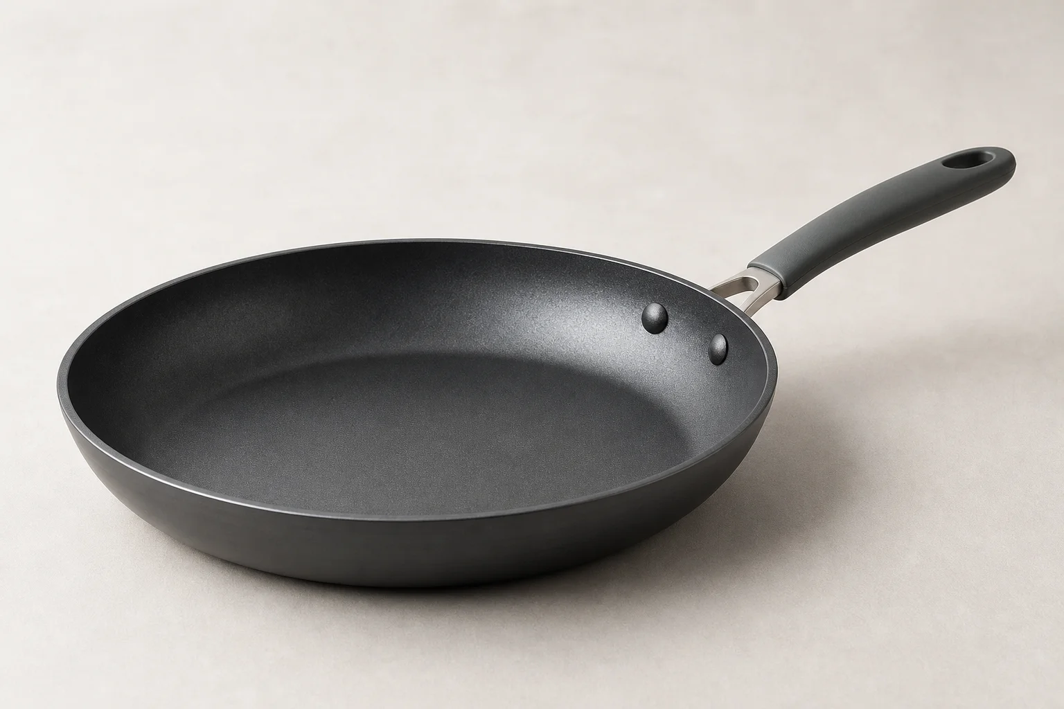 Collection of budget cookware including stainless steel, cast iron, non-stick, and enameled pans