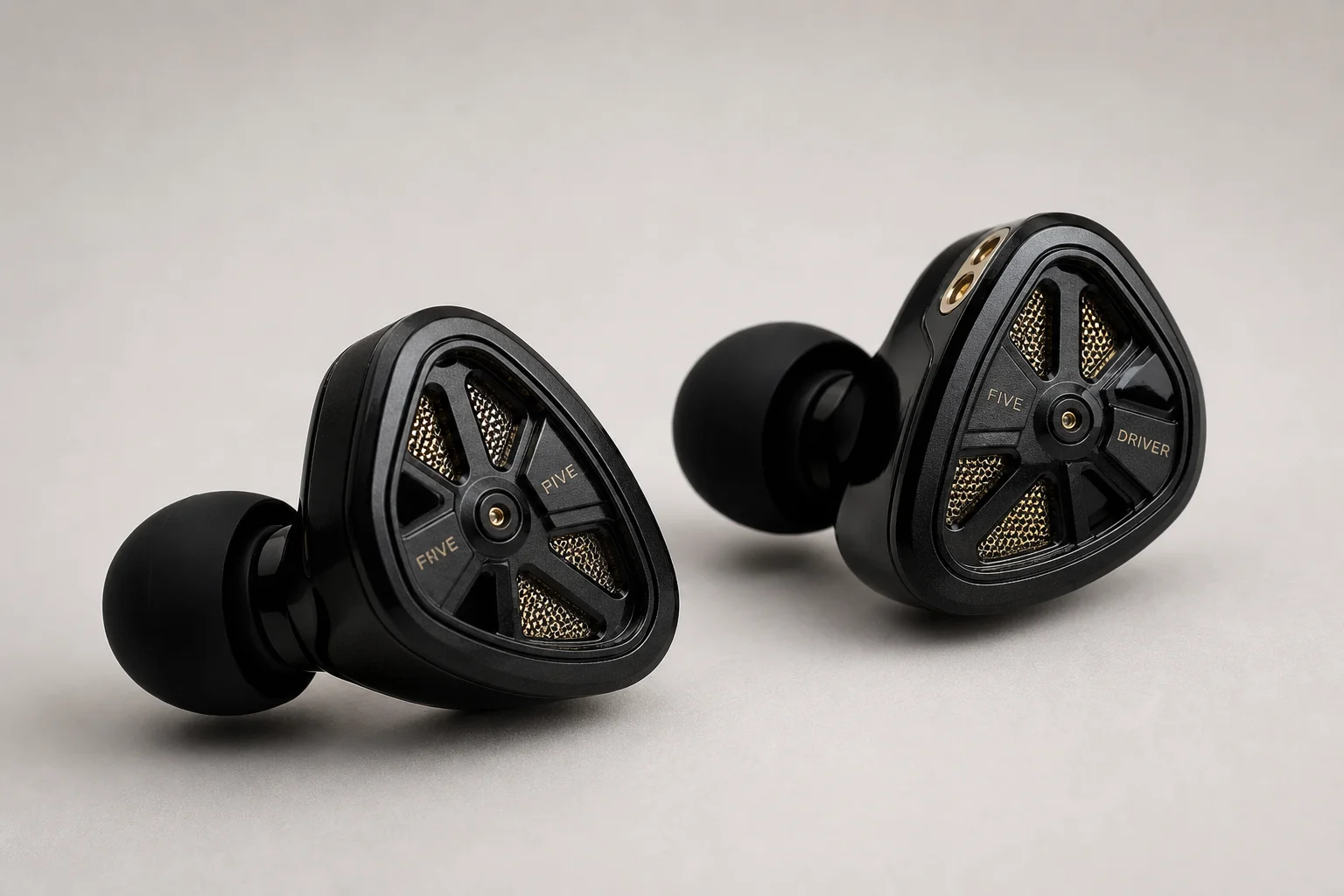 Nine earbud models arranged on concrete surface representing budget to premium options