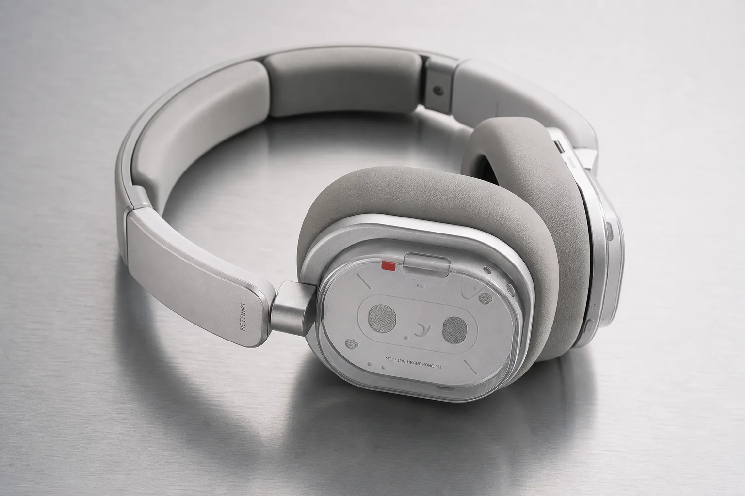 Nothing Headphones (a) showing the over-ear design and metal hinge construction