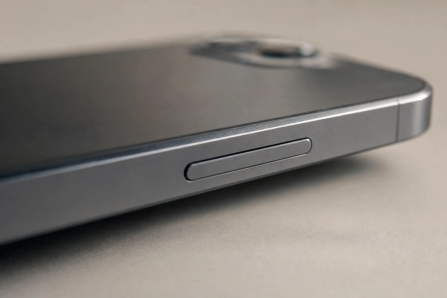 Smartphone unibody aluminium frame showing metal construction and fingerprints