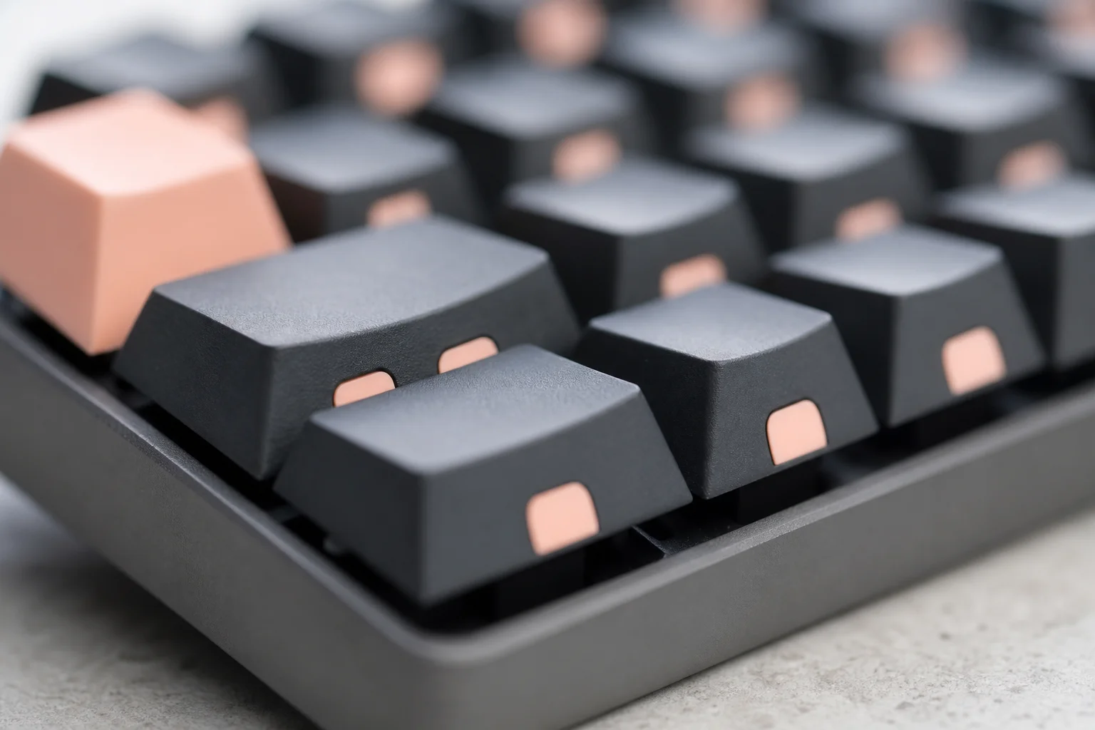 Close-up of double-shot PBT keycaps with accent colors on a mechanical keyboard