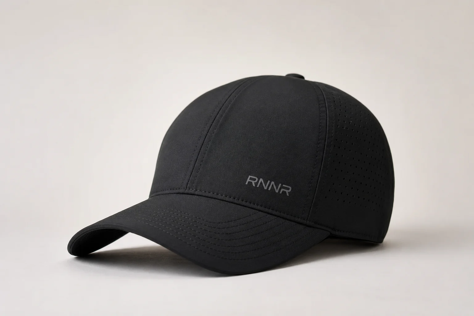Nine running caps in various styles and colors arranged on neutral backdrop