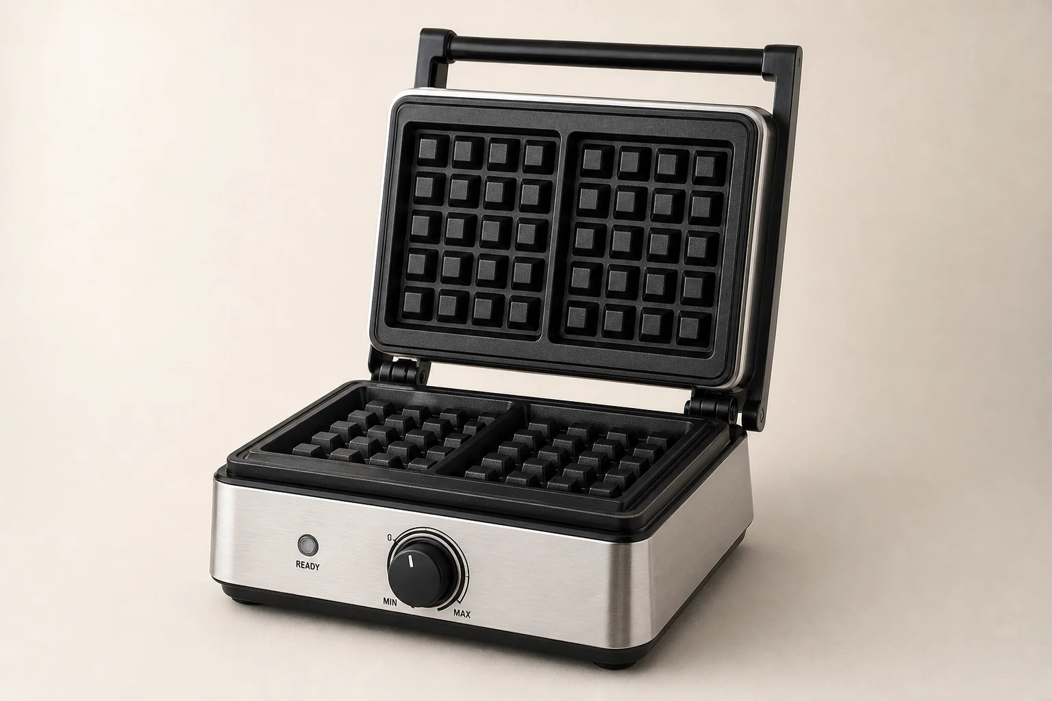 Five waffle makers arranged on concrete surface from budget to premium models