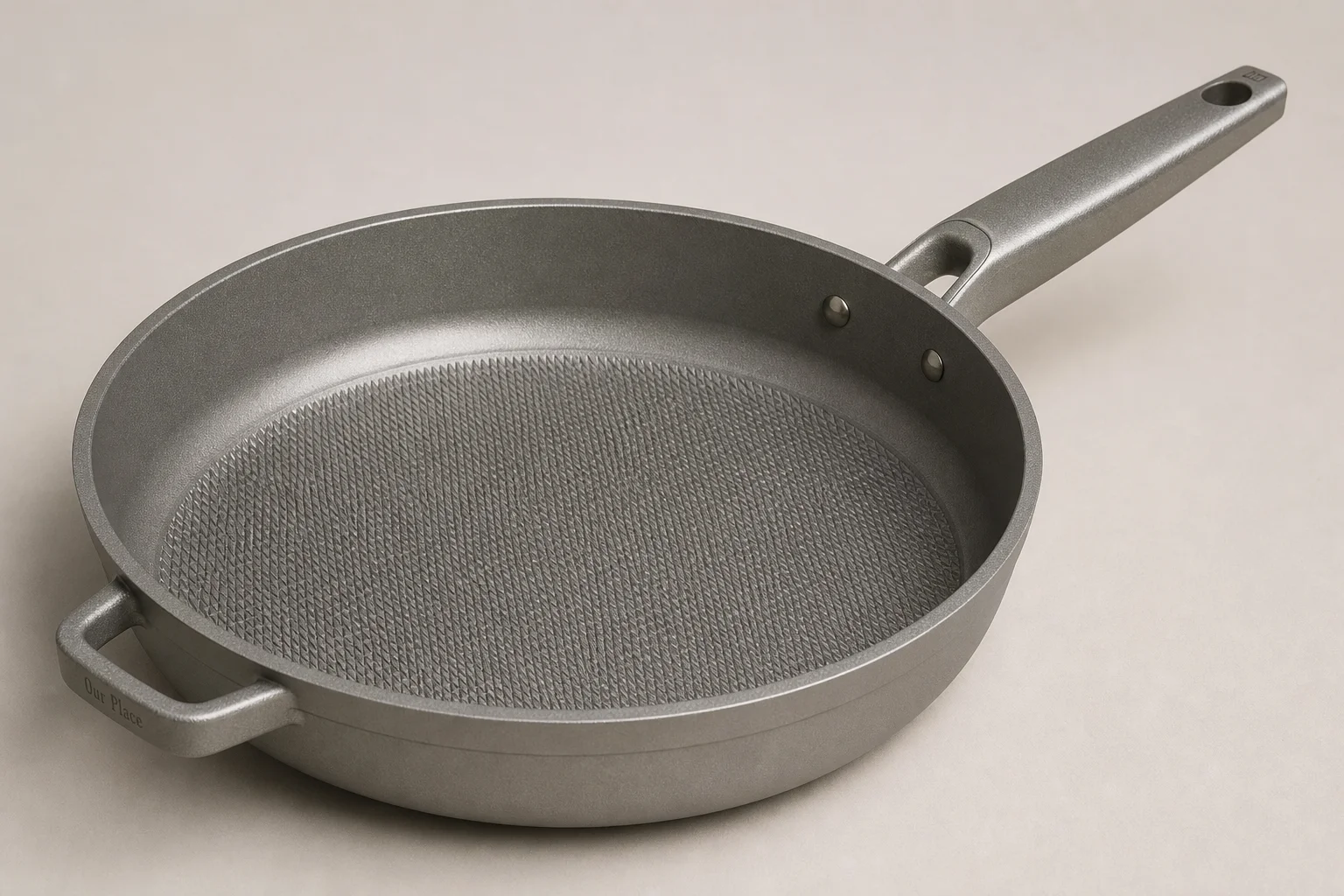 Five cookware brands displayed together on neutral backdrop