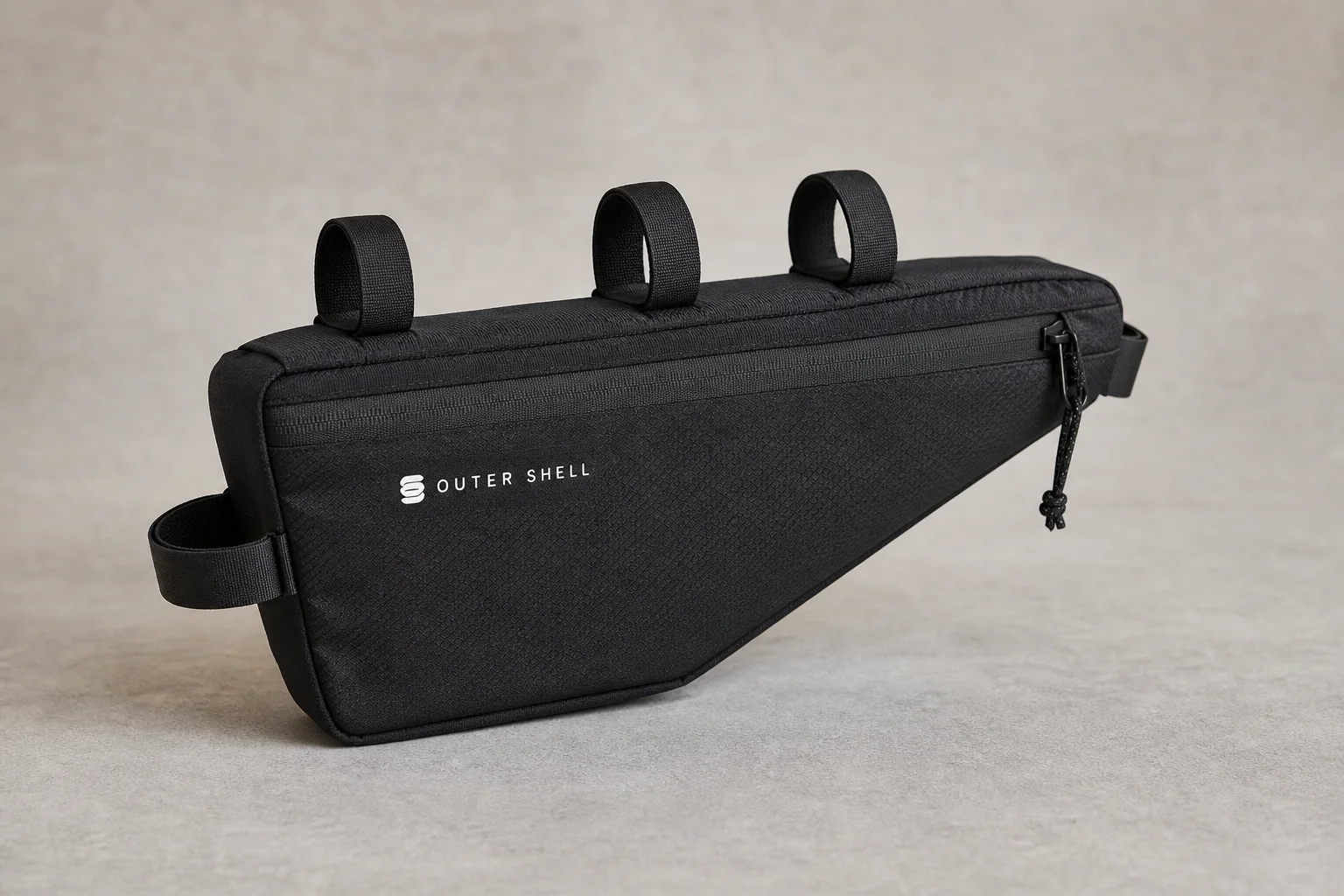 Six Outer Shell bike packing bags in various colors and sizes on neutral backdrop