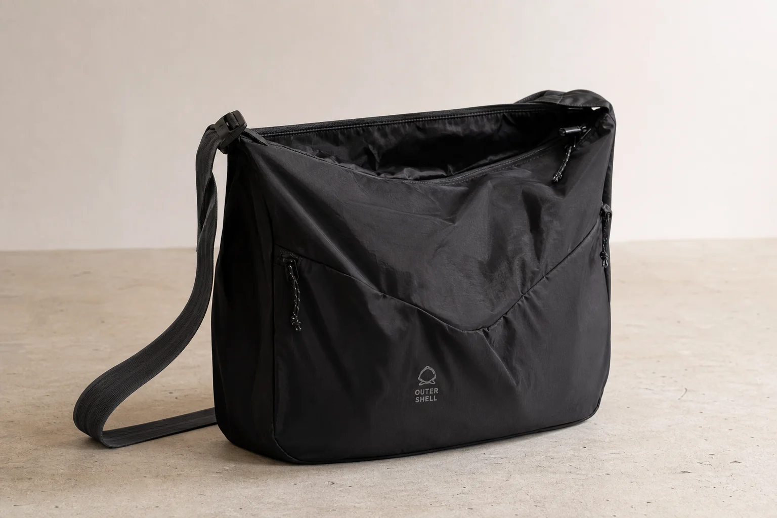 Six Outer Shell bike packing bags in various colors and sizes on neutral backdrop