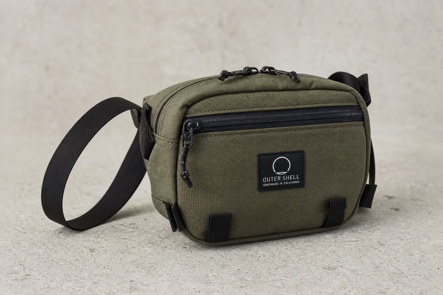 Six Outer Shell bike packing bags in various colors and sizes on neutral backdrop
