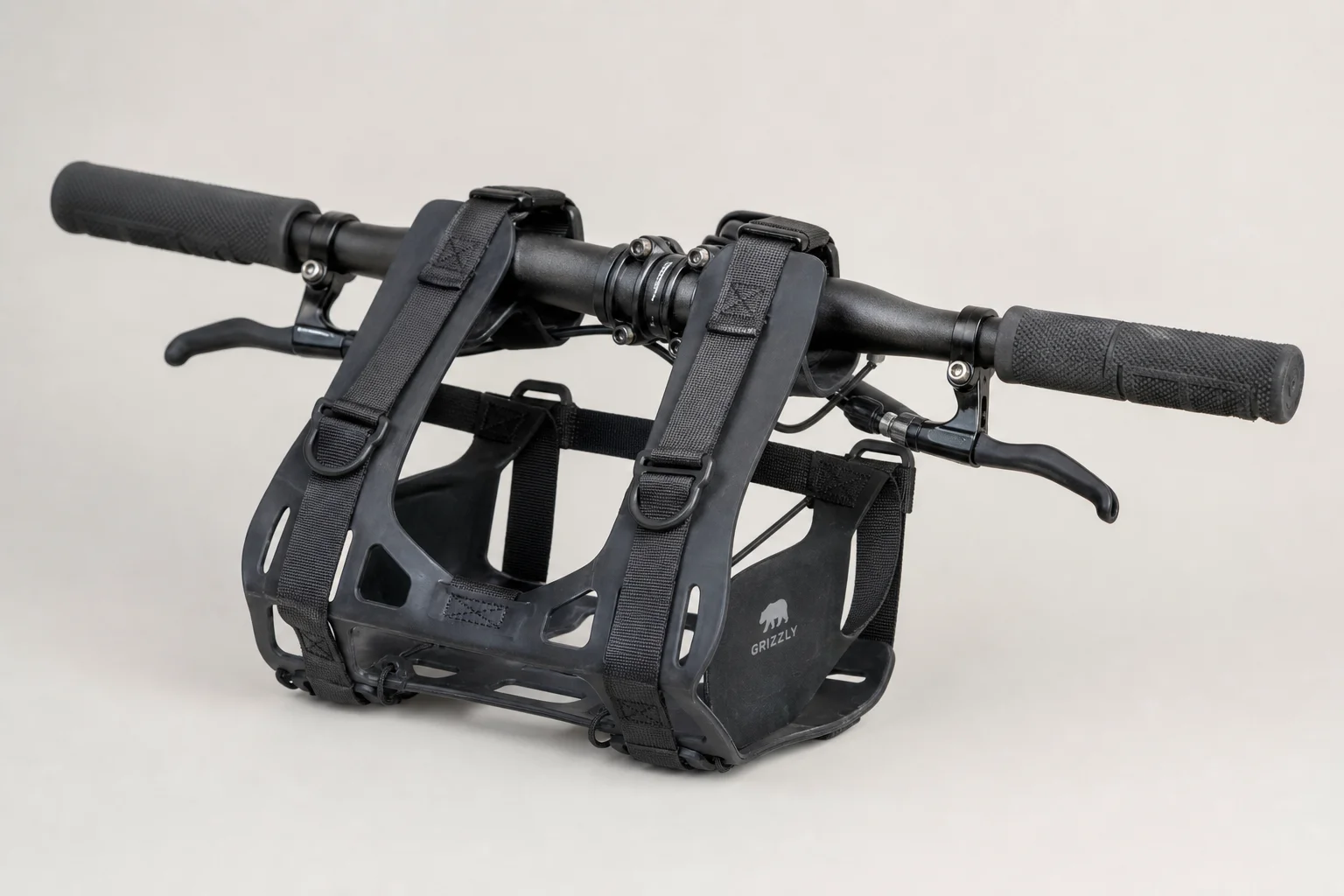 Fully loaded hardtail mountain bike with bikepacking gear on neutral backdrop