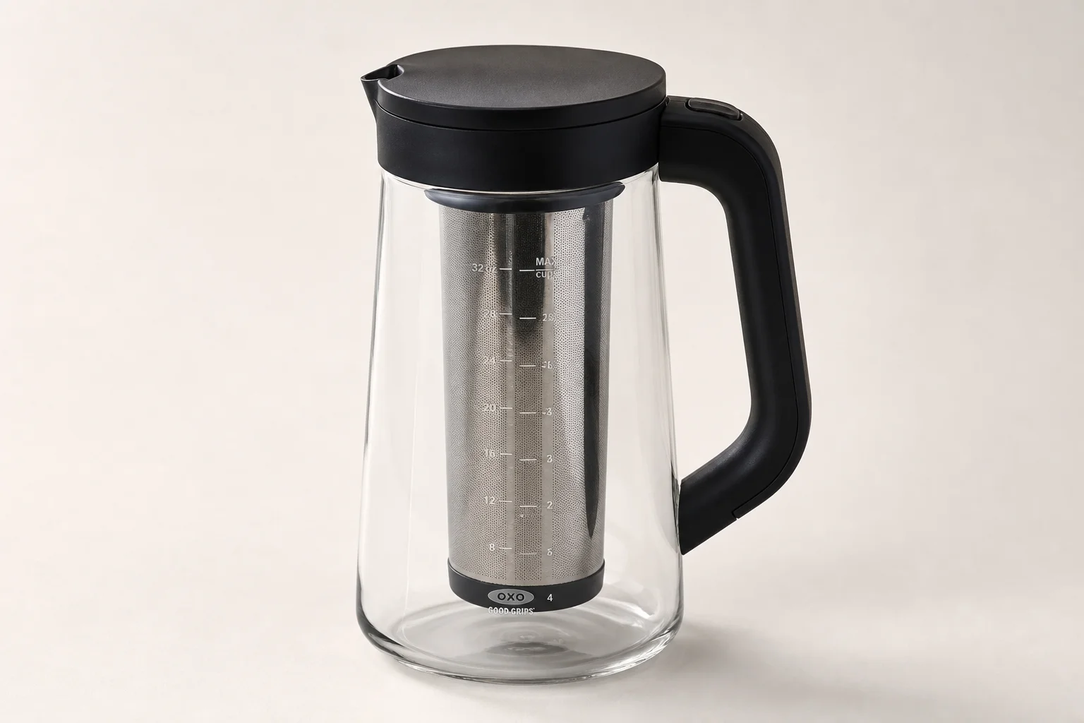Four cold brew coffee makers displayed on concrete surface
