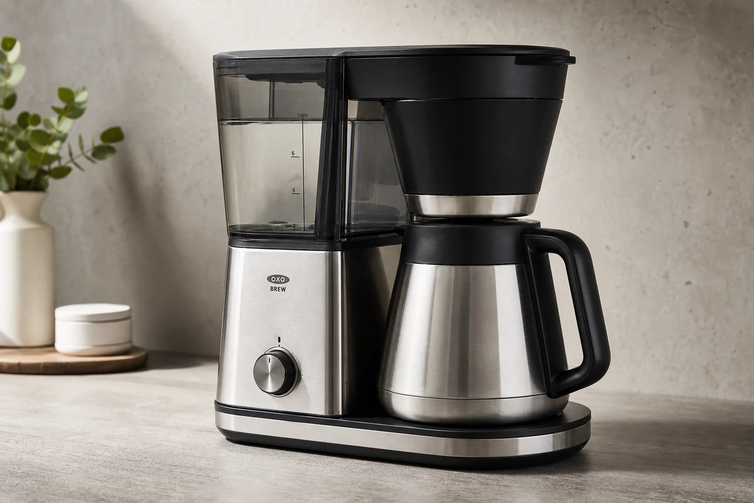 Five drip coffee makers arranged on concrete surface from budget to premium