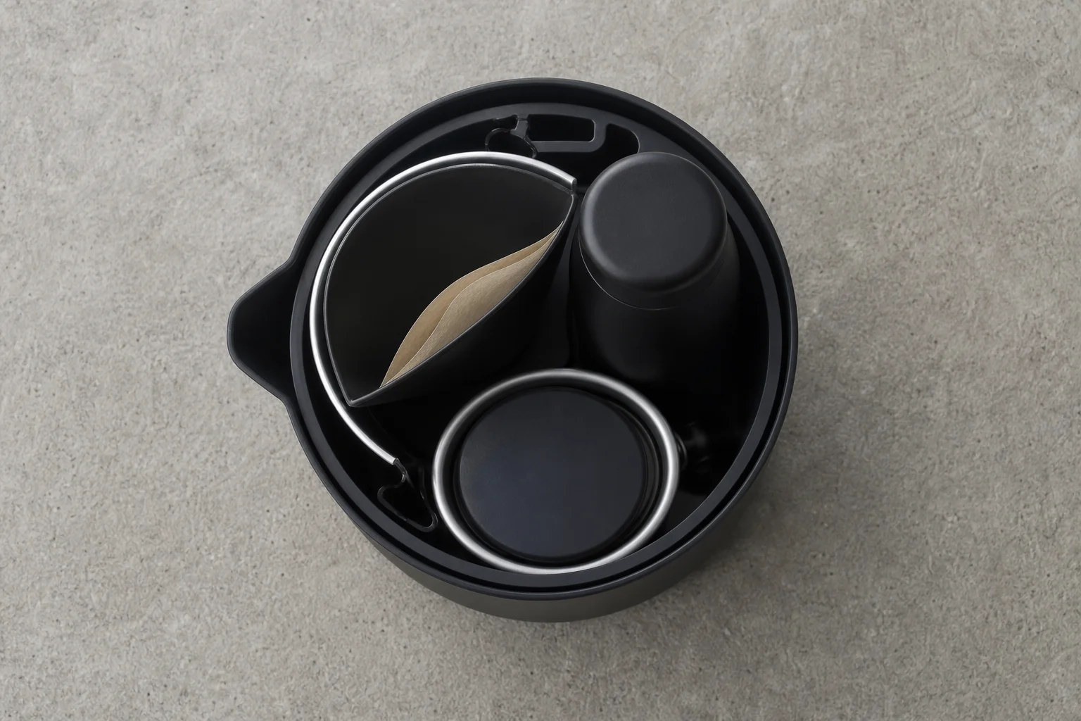 Travel coffee kit components nested together in compact arrangement