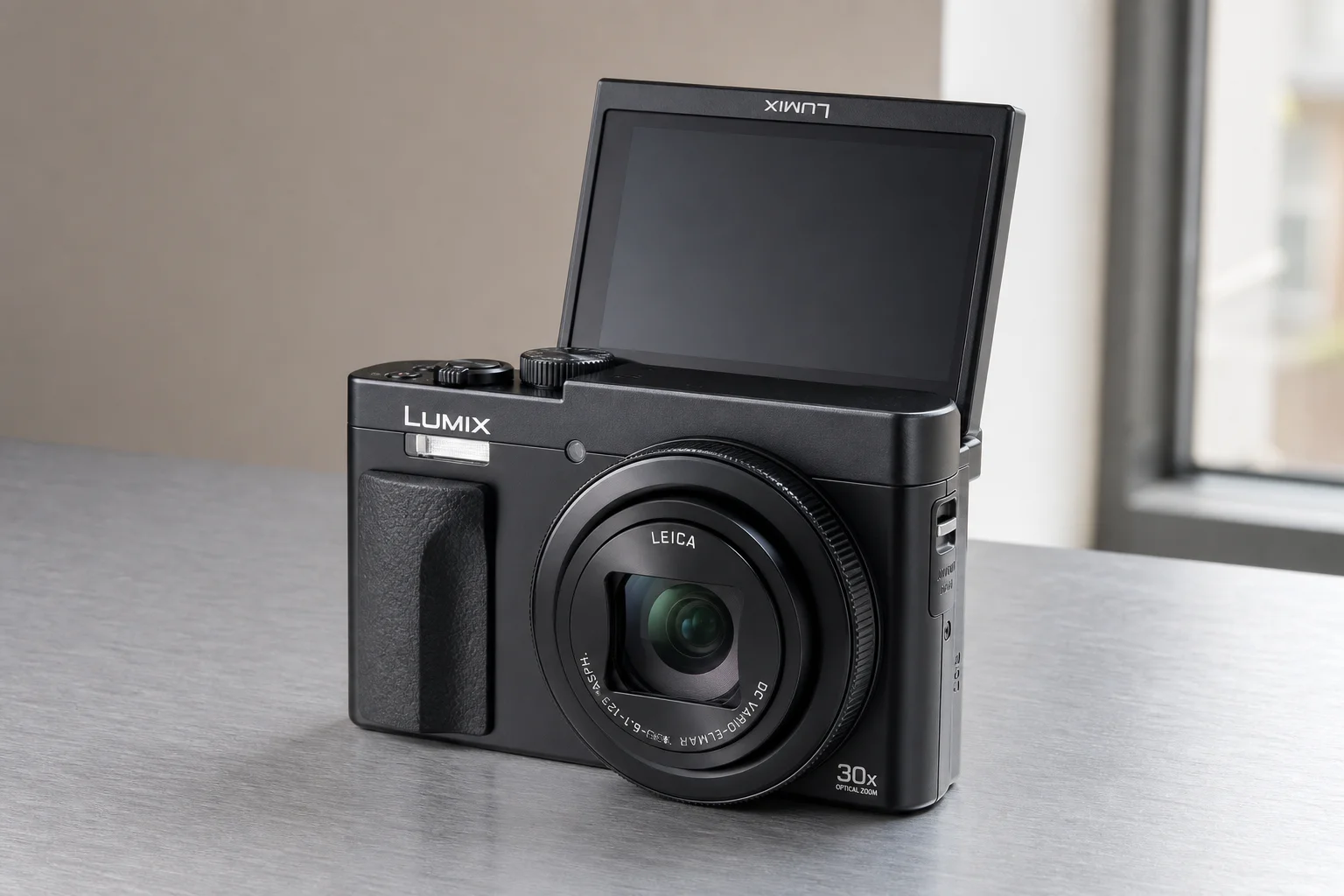 Six compact cameras arranged on concrete surface showing different designs and features