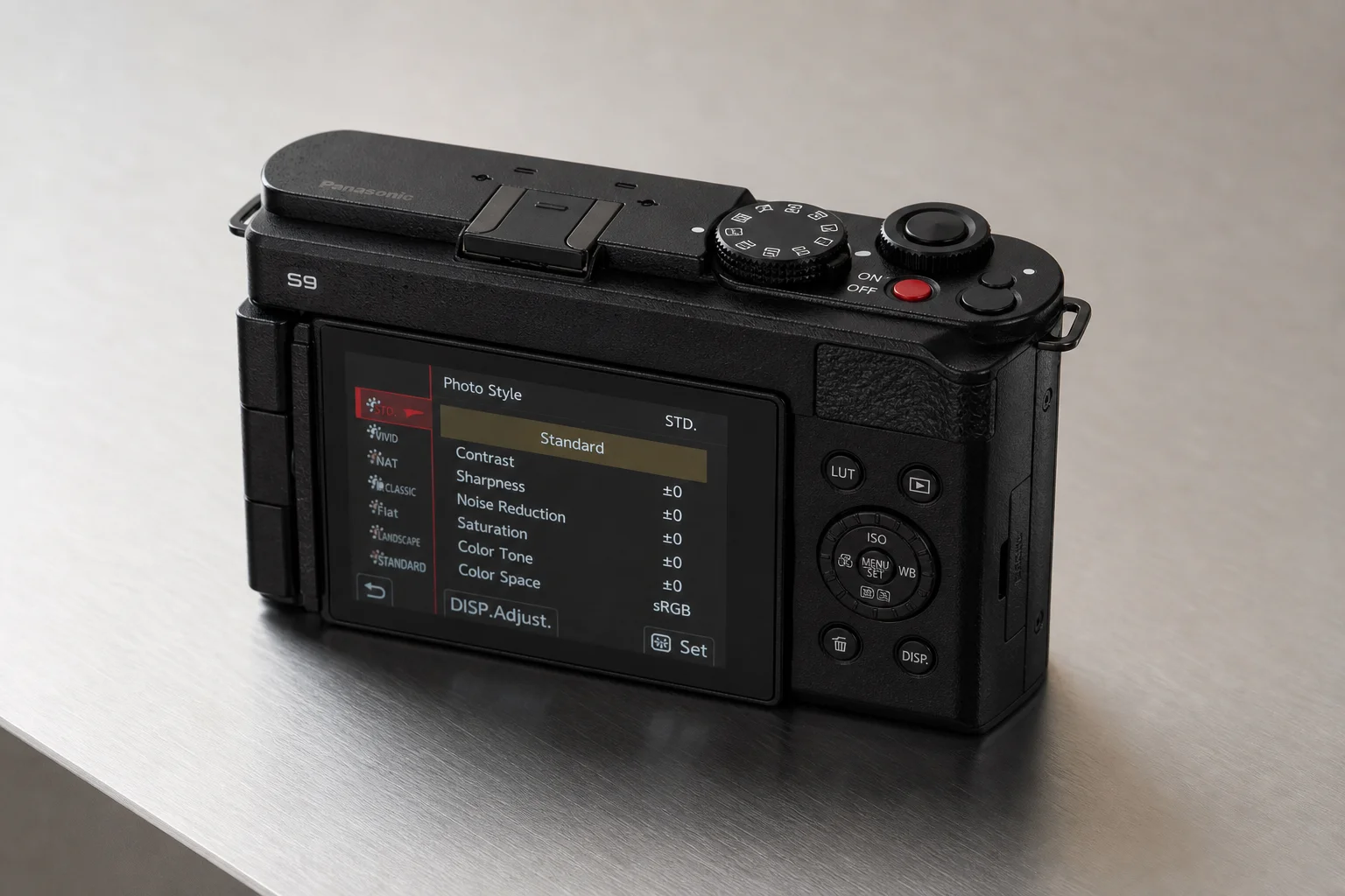 Panasonic S9 compact full-frame camera with 18-40mm lens on grey backdrop
