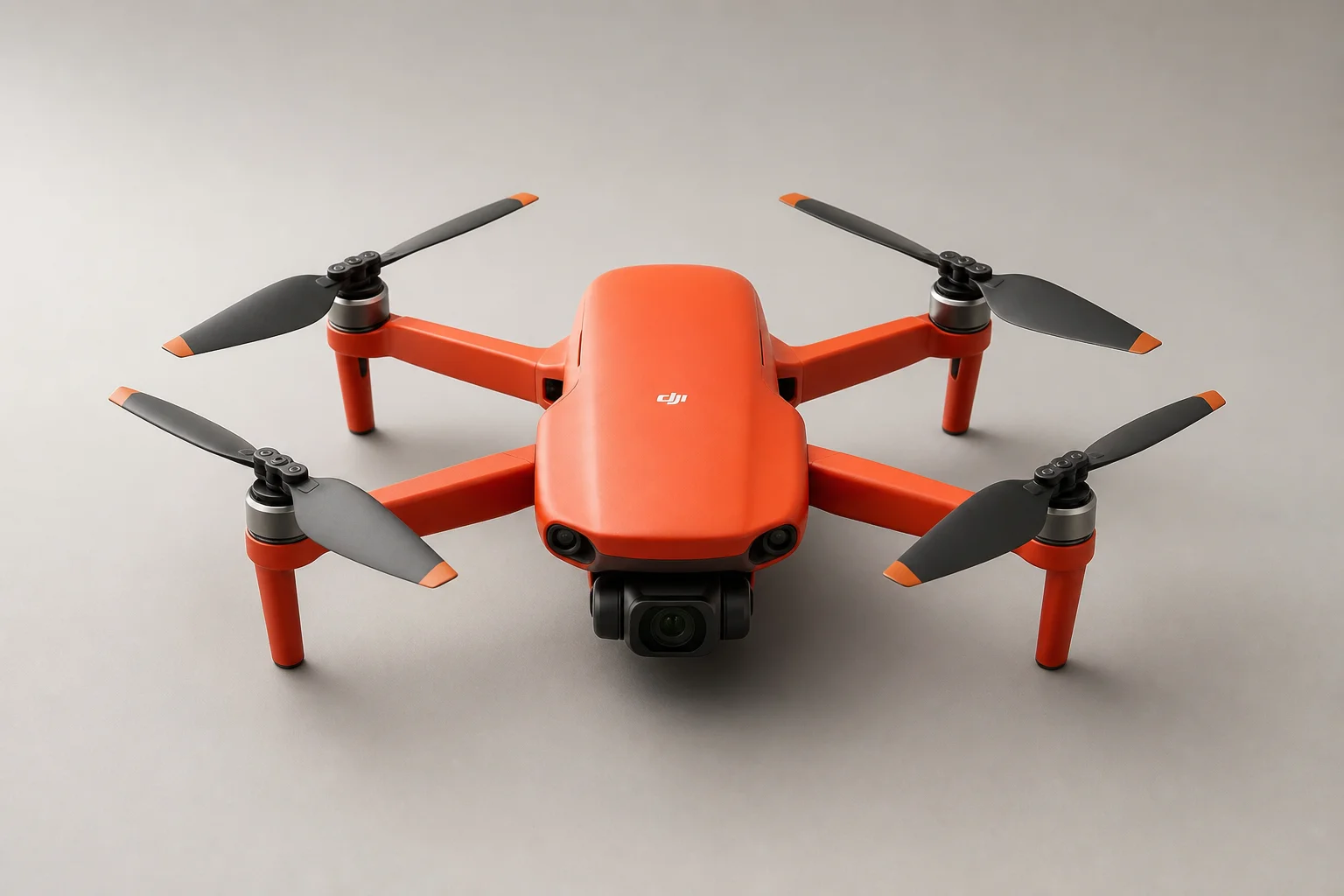 Five budget drones arranged on grey concrete surface