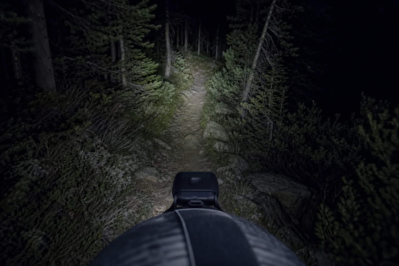 Ultralight headlamp mounted on a runner's forehead during night trail running