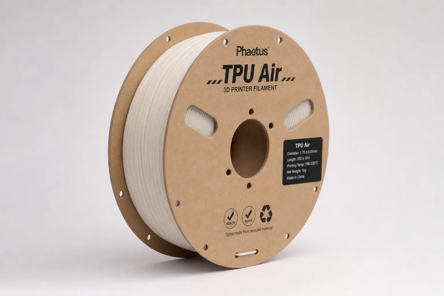 Collection de bobines de filament pour imprimante 3D sur une surface en béton