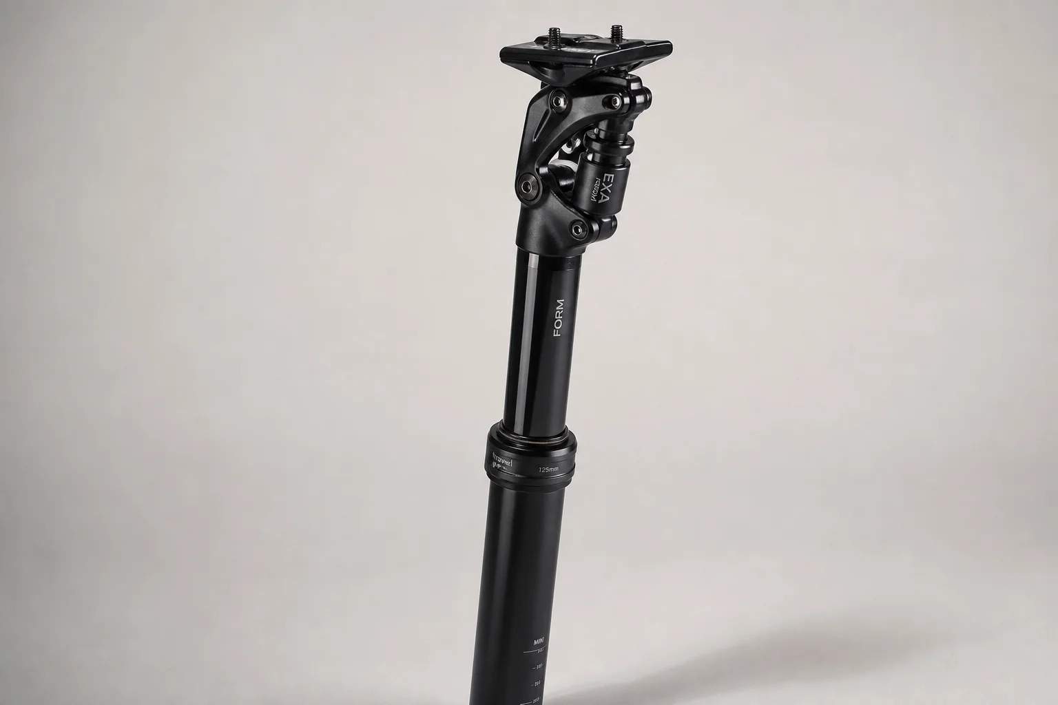 Fully loaded hardtail mountain bike with bikepacking gear on neutral backdrop